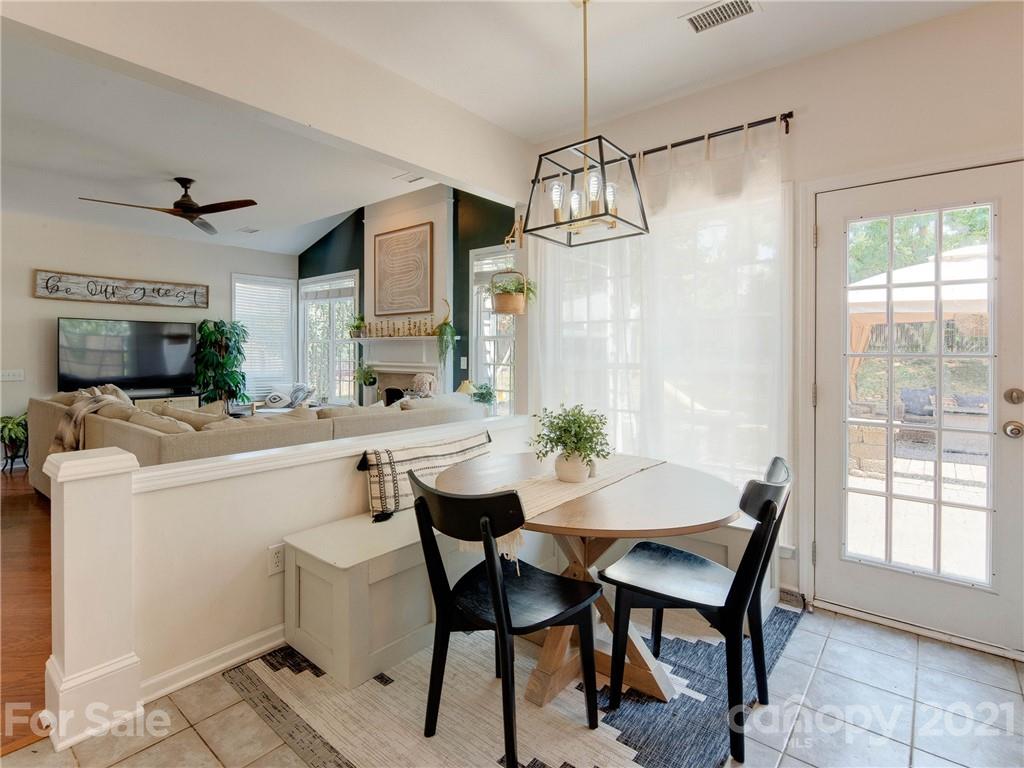2405 Coltsgate Road Waxhaw, NC 28173 - Photo 18 of 48 a view of a dining room with furniture window and wooden floor