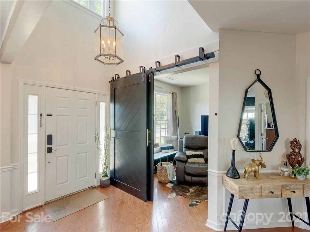 2405 Coltsgate Road Waxhaw, NC 28173 - Photo 3 of 48 a view of a livingroom with furniture and a mirror