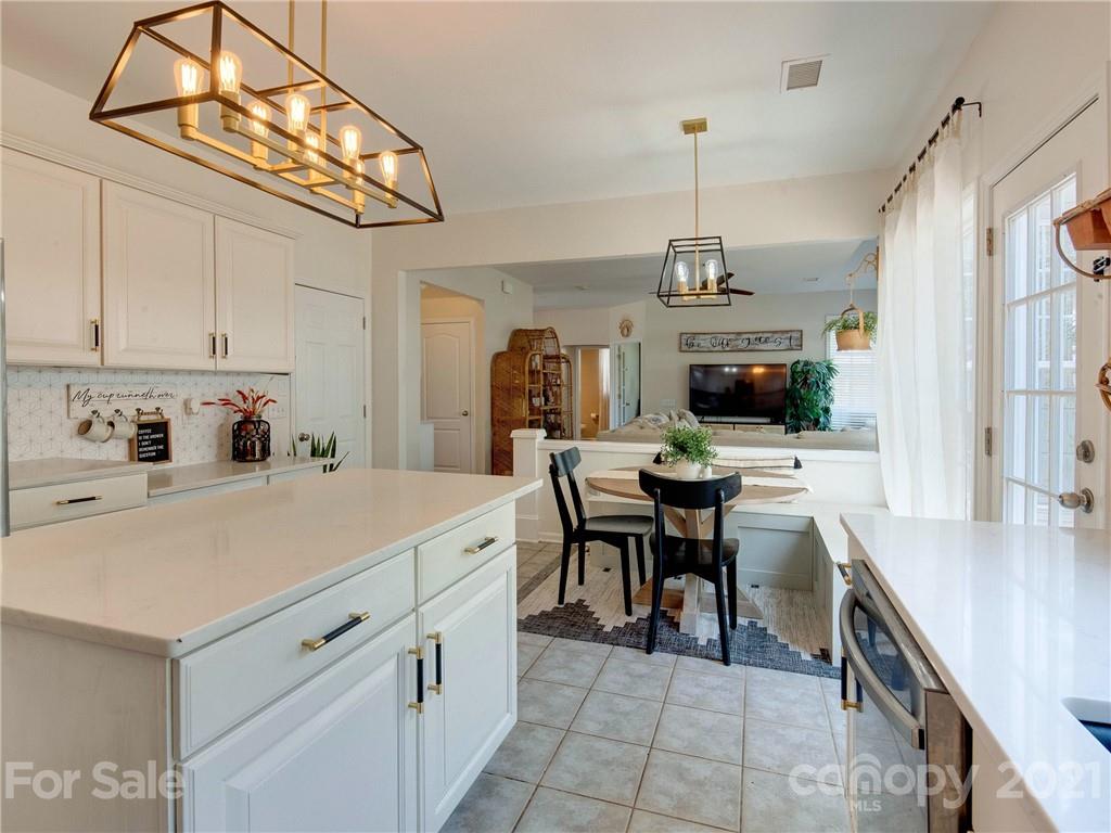 2405 Coltsgate Road Waxhaw, NC 28173 - Photo 23 of 48 a kitchen that has a cabinets a sink and a stove in it