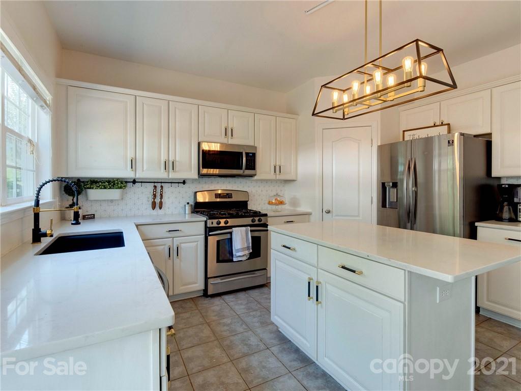 2405 Coltsgate Road Waxhaw, NC 28173 - Photo 24 of 48 a kitchen with a sink appliances and cabinets