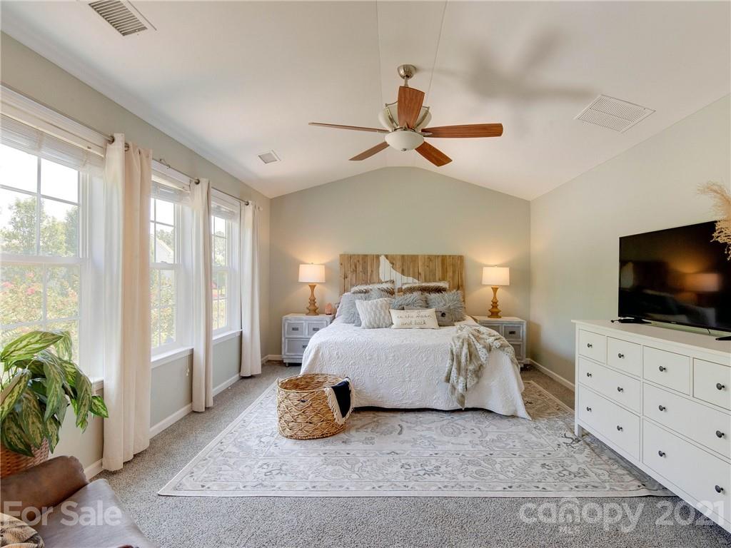 2405 Coltsgate Road Waxhaw, NC 28173 - Photo 29 of 48 a living room with furniture and a flat screen tv
