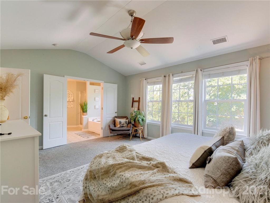 2405 Coltsgate Road Waxhaw, NC 28173 - Photo 31 of 48 a bedroom with a bed and a large window