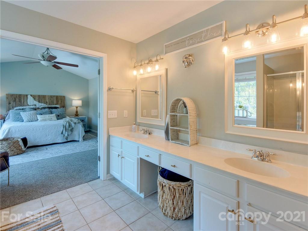 2405 Coltsgate Road Waxhaw, NC 28173 - Photo 32 of 48 a spacious bathroom with a double vanity sink mirror and