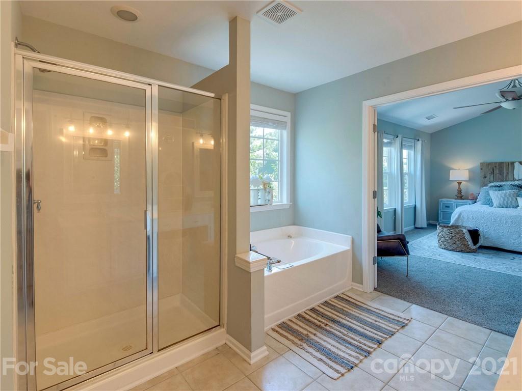 2405 Coltsgate Road Waxhaw, NC 28173 - Photo 35 of 48 a bathroom with a tub shower and sink
