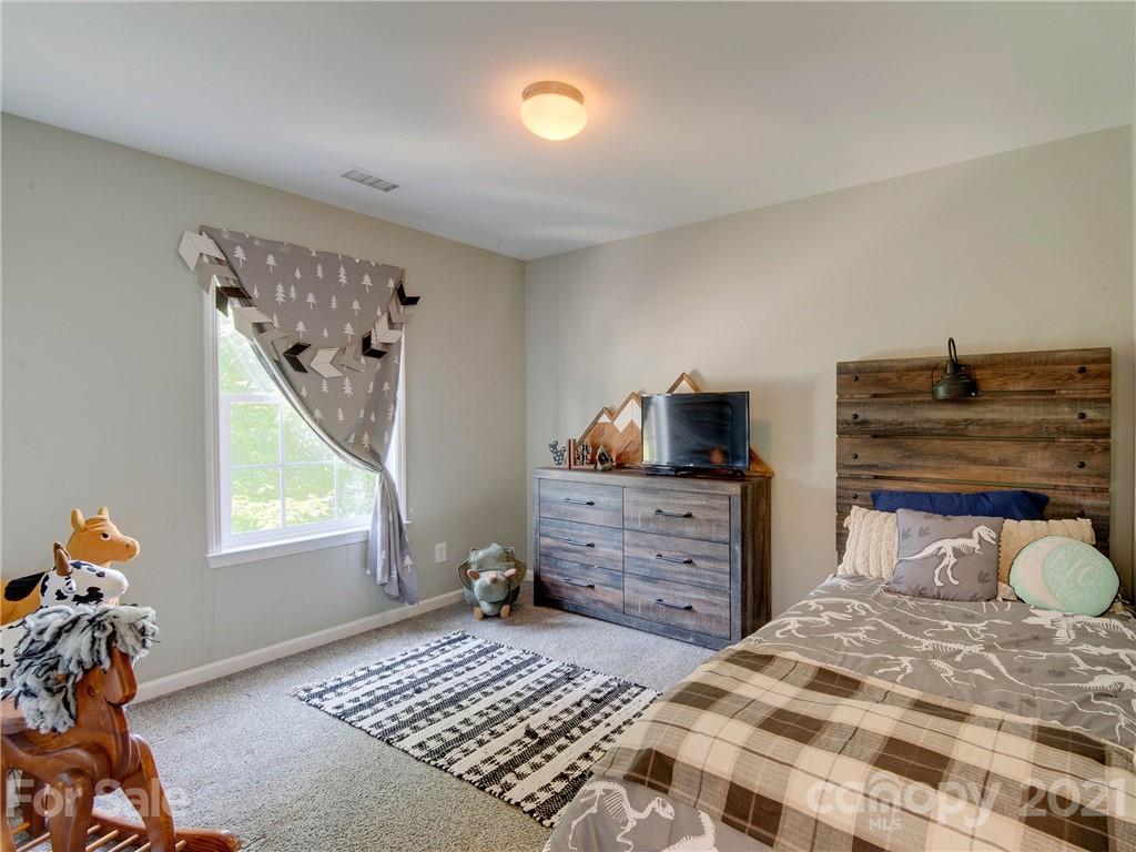 2405 Coltsgate Road Waxhaw, NC 28173 - Photo 38 of 48 a bedroom with a bed and a window