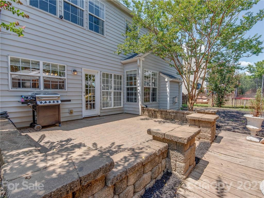 2405 Coltsgate Road Waxhaw, NC 28173 - Photo 41 of 48 a view of a house with backyard sitting area