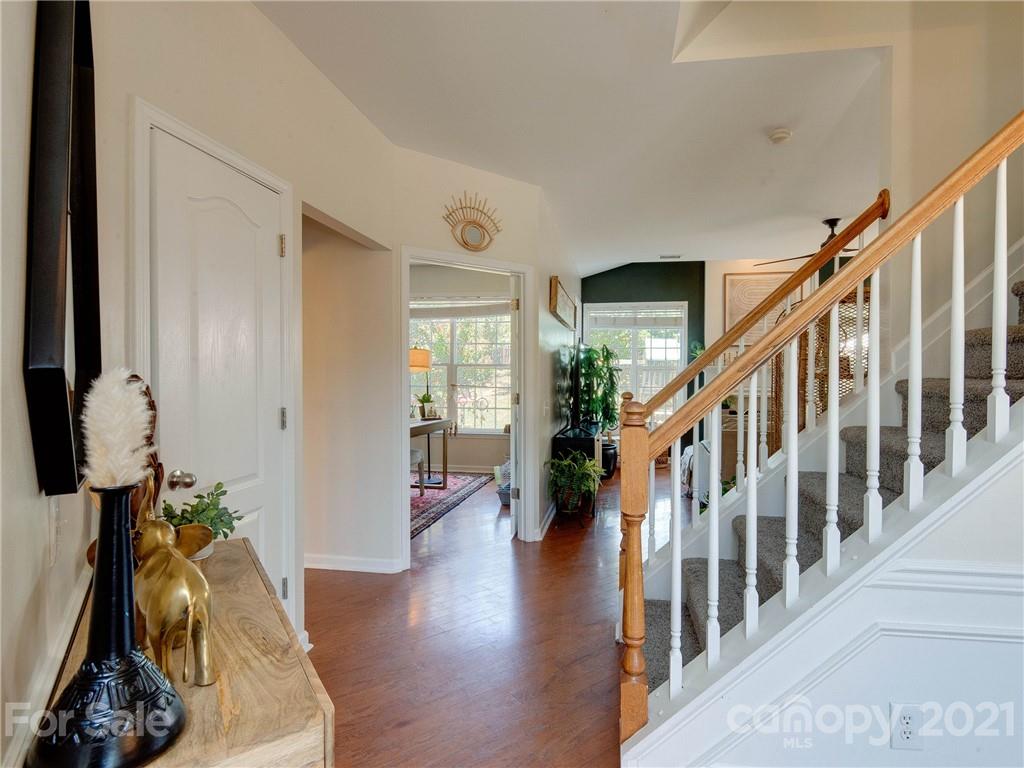 2405 Coltsgate Road Waxhaw, NC 28173 - Photo 9 of 48 a view of entryway with wooden floor and stairs