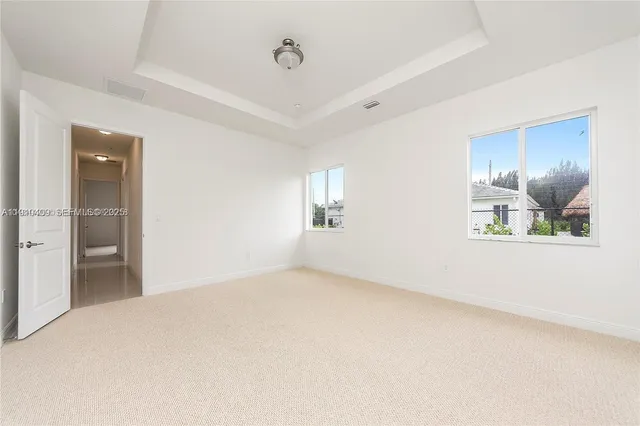 a view of an empty room and window