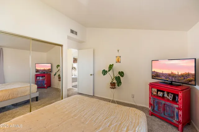 a bedroom with a bed and furniture