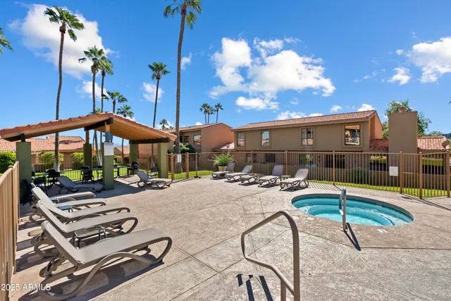 a patio with tables and chairs
