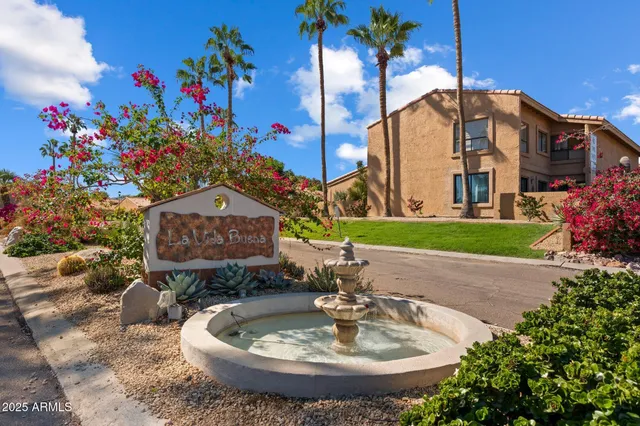 a sign that is sitting in front of a house