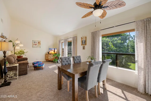 a view of a dining room with furniture window and outside view