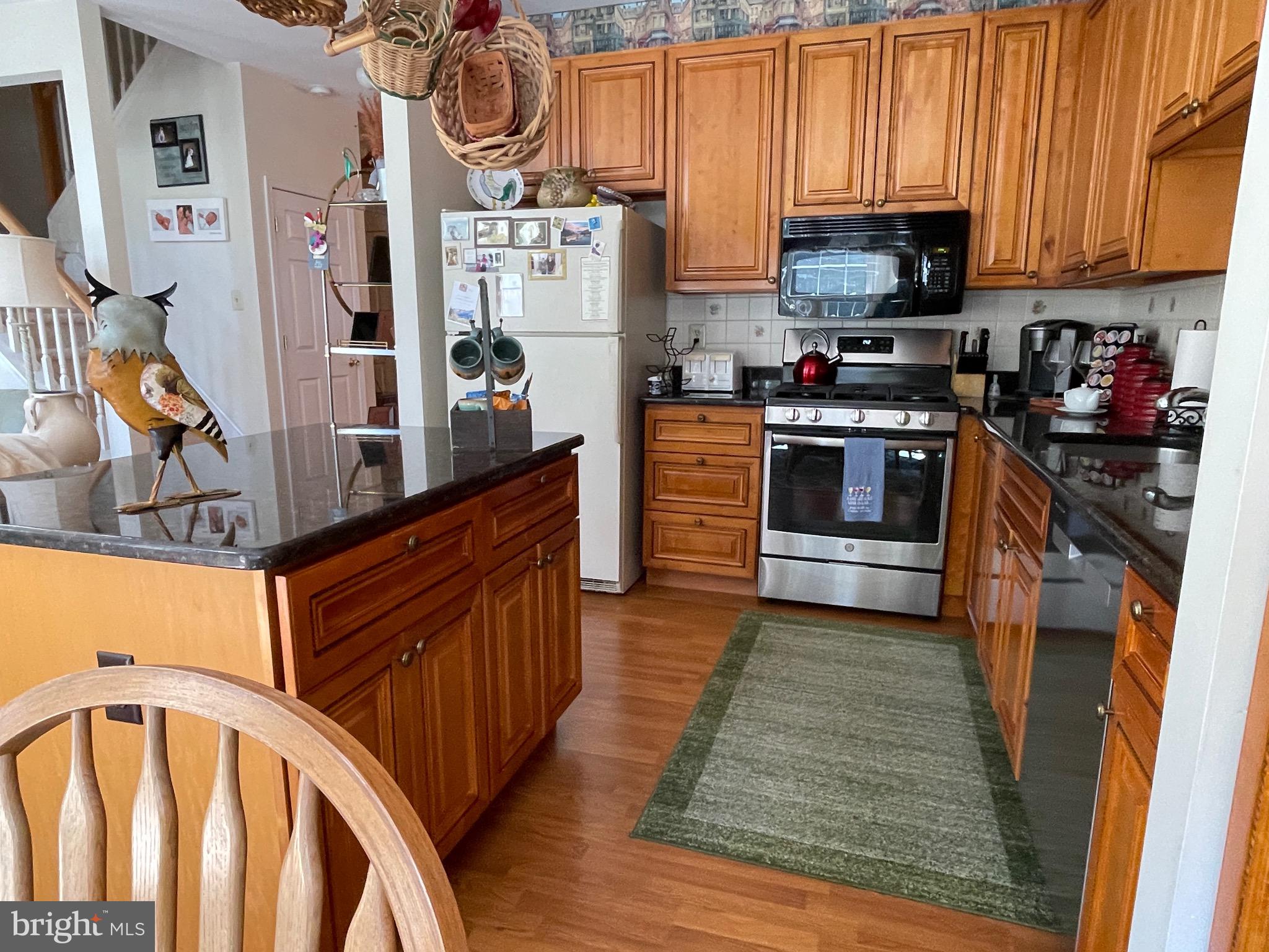 404 Fairview Way New Hope, PA 18938 - Photo 12 of 27 a kitchen with stainless steel appliances granite countertop a stove top oven a sink and a refrigerator