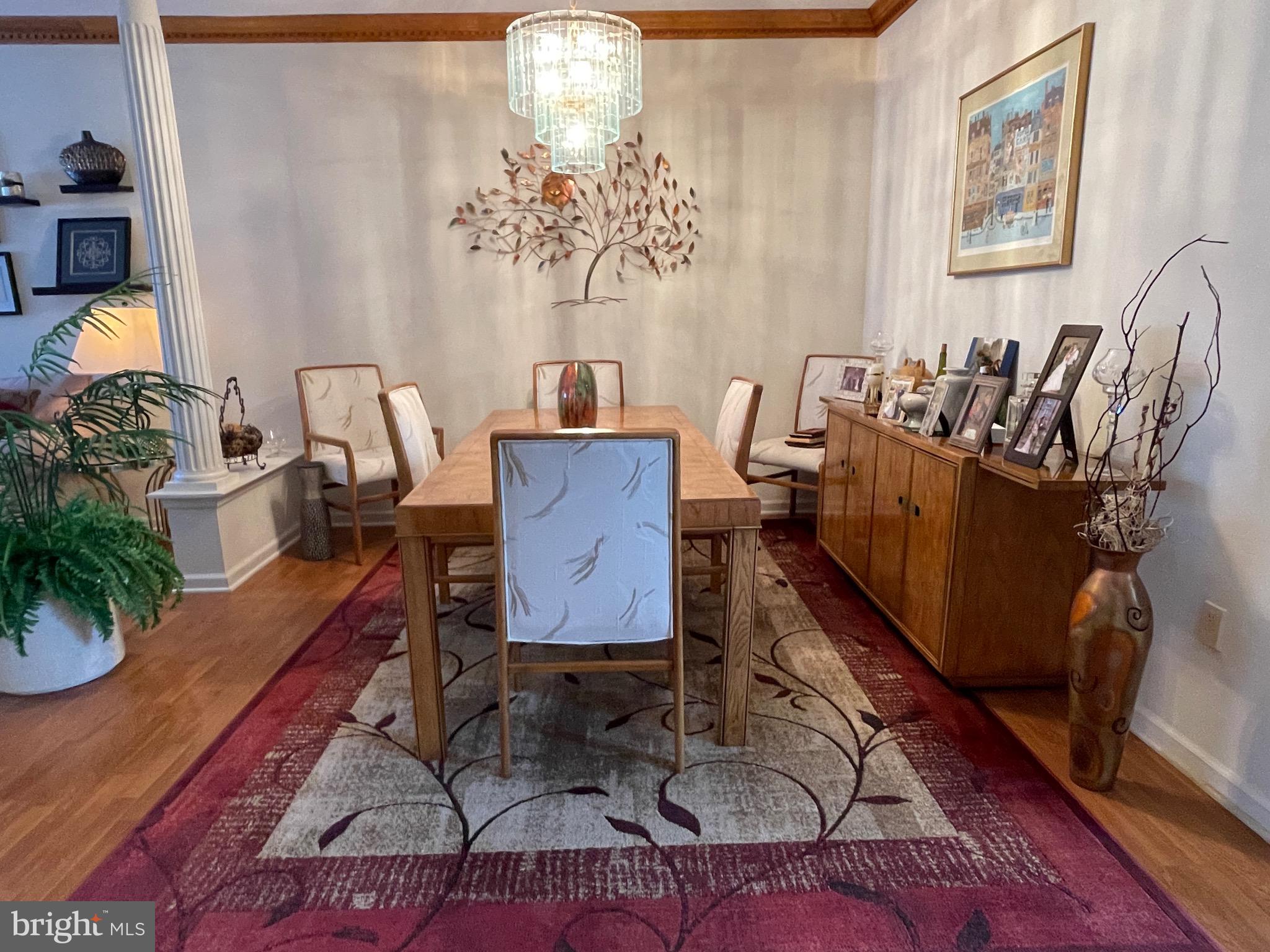 404 Fairview Way New Hope, PA 18938 - Photo 3 of 27 a dining room with furniture potted plants and wooden floor
