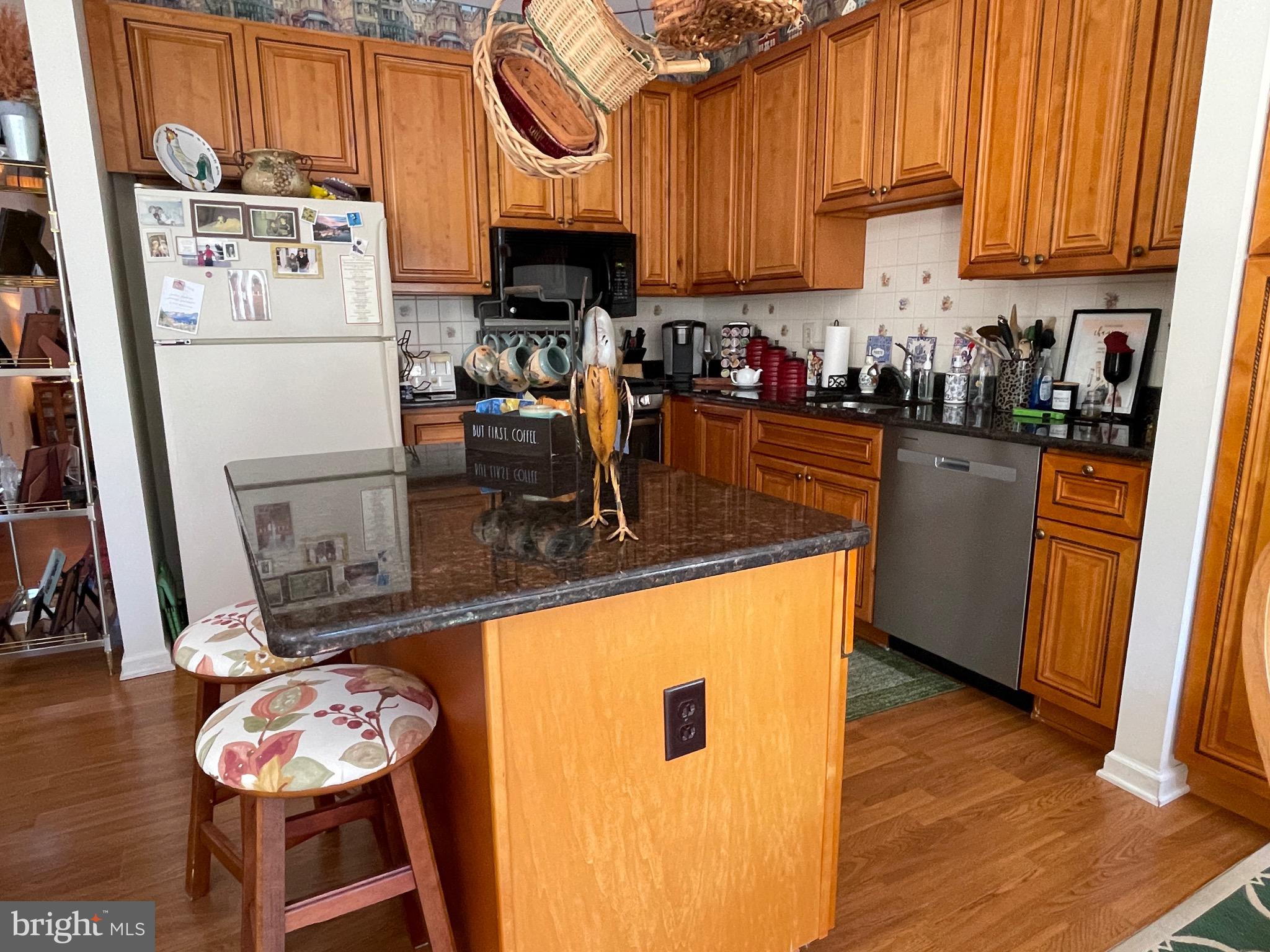 404 Fairview Way New Hope, PA 18938 - Photo 9 of 27 a kitchen with stainless steel appliances granite countertop a refrigerator a stove and a wooden floors