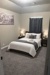 a bedroom with bed and window