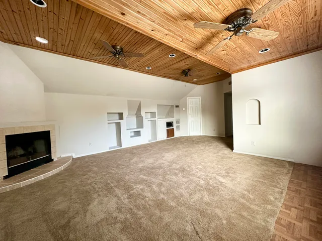 a view of empty room with a fireplace