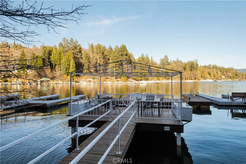 27589 West Shore Road Lake Arrowhead, CA 92352 - Photo 11 of 11 a view of a balcony with wooden floor and outdoor seating