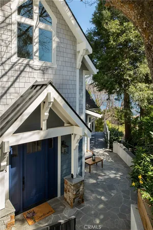 a view of a patio with table and chairs with wooden fence and plants