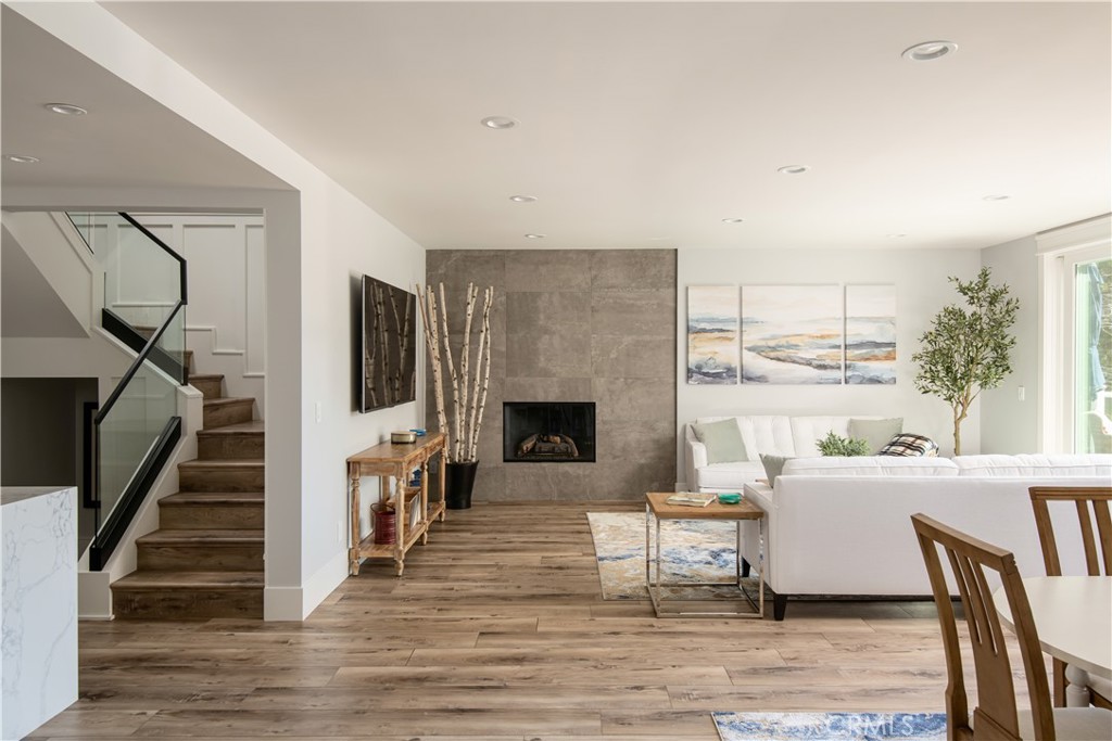 27589 West Shore Road Lake Arrowhead, CA 92352 - Photo 6 of 11 a living room with furniture a fireplace and a flat screen tv