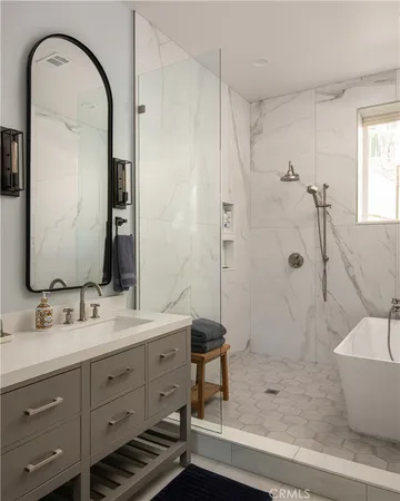 a bathroom with a double vanity sink mirror and shower