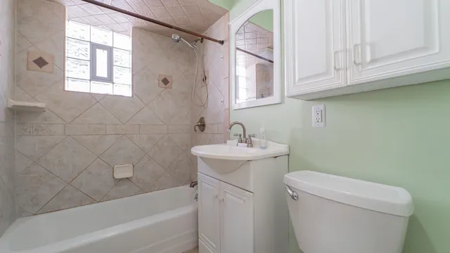 a bathroom with a sink a toilet and bathtub