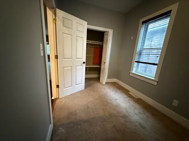 a view of a hallway with staircase