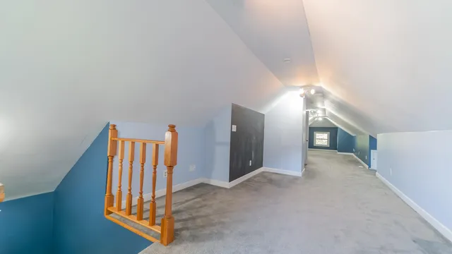 a view of empty room with window and ceiling fan