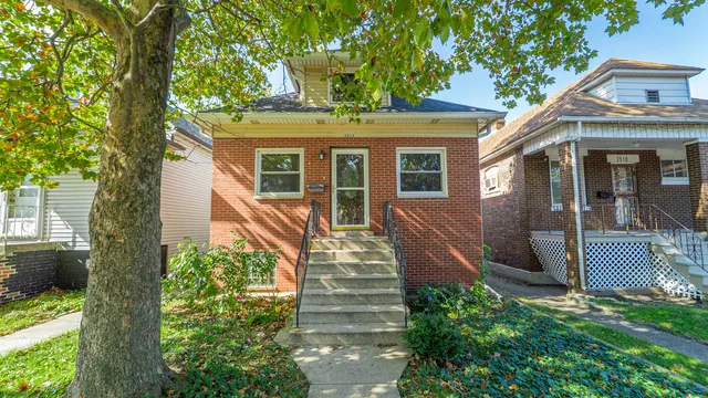 front view of a house with a small yard