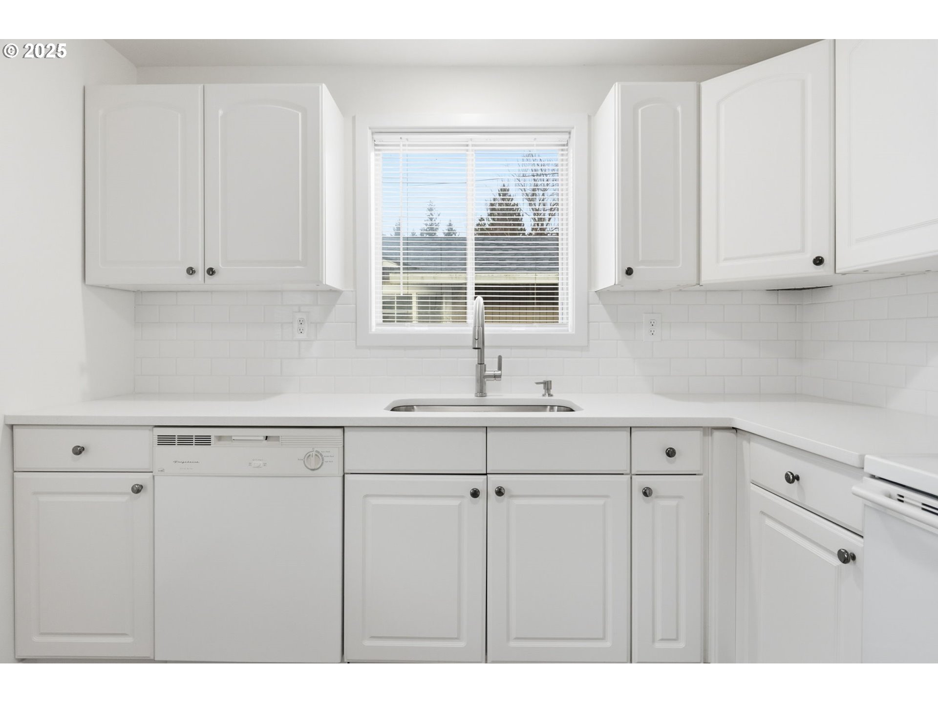 117 North 9th Avenue Ridgefield, WA 98642 - Photo 13 of 47 a kitchen with appliances cabinets and a sink