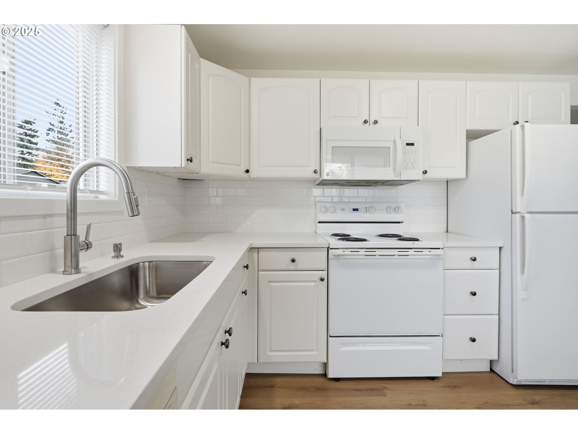 117 North 9th Avenue Ridgefield, WA 98642 - Photo 14 of 47 a kitchen with cabinets appliances a sink and a counter top