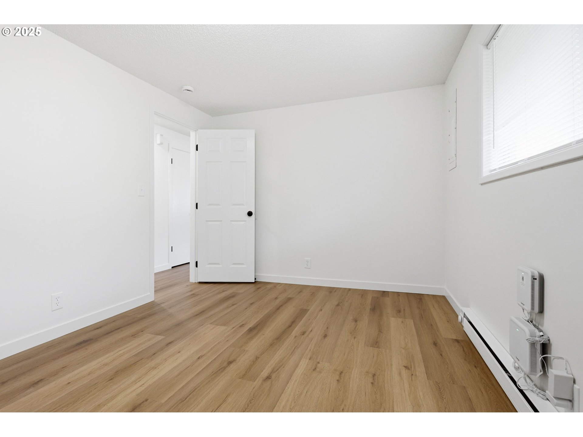 117 North 9th Avenue Ridgefield, WA 98642 - Photo 17 of 47 a view of an empty room and wooden floor