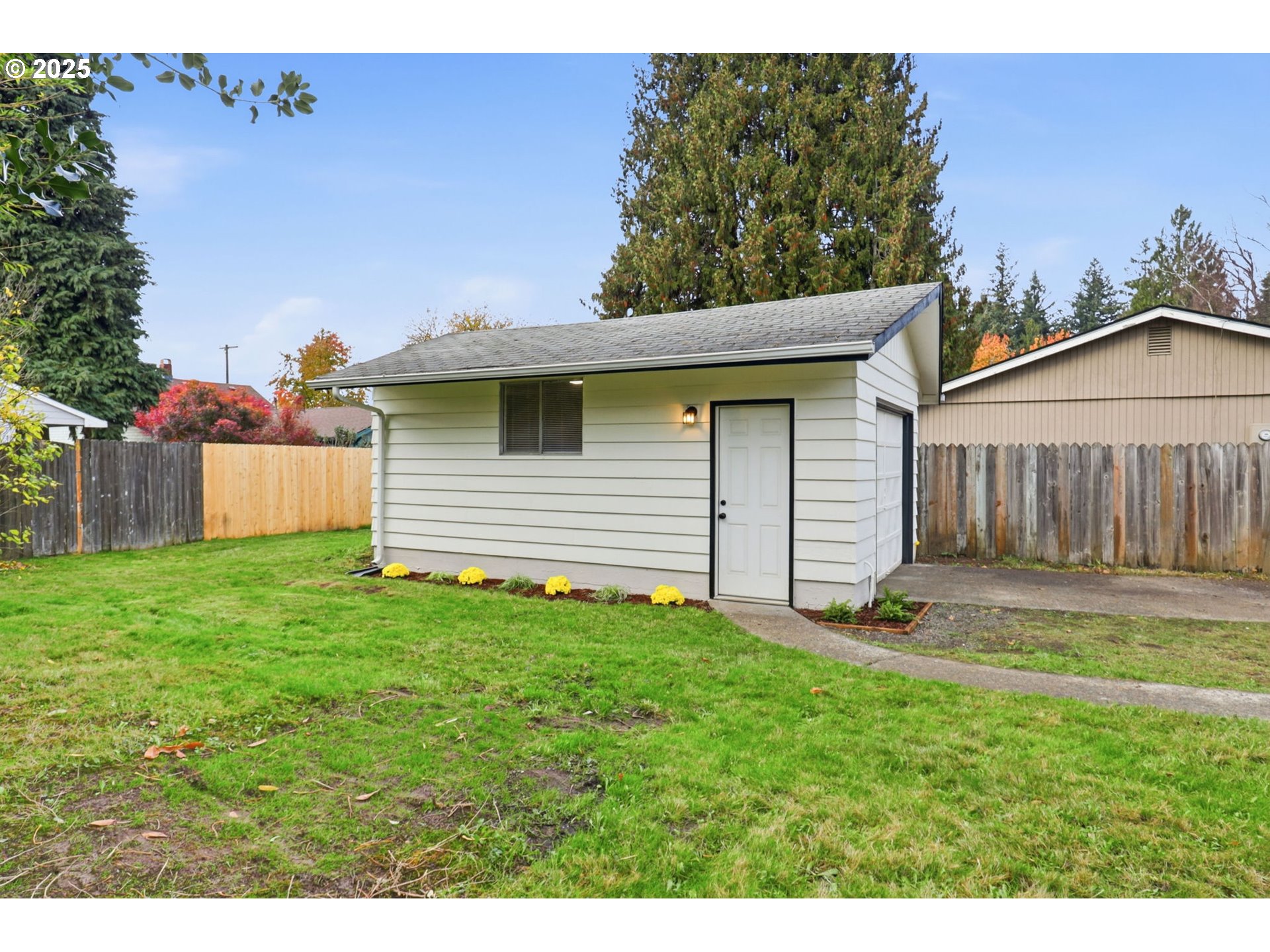 117 North 9th Avenue Ridgefield, WA 98642 - Photo 26 of 47 a backyard of a house with lots of green space