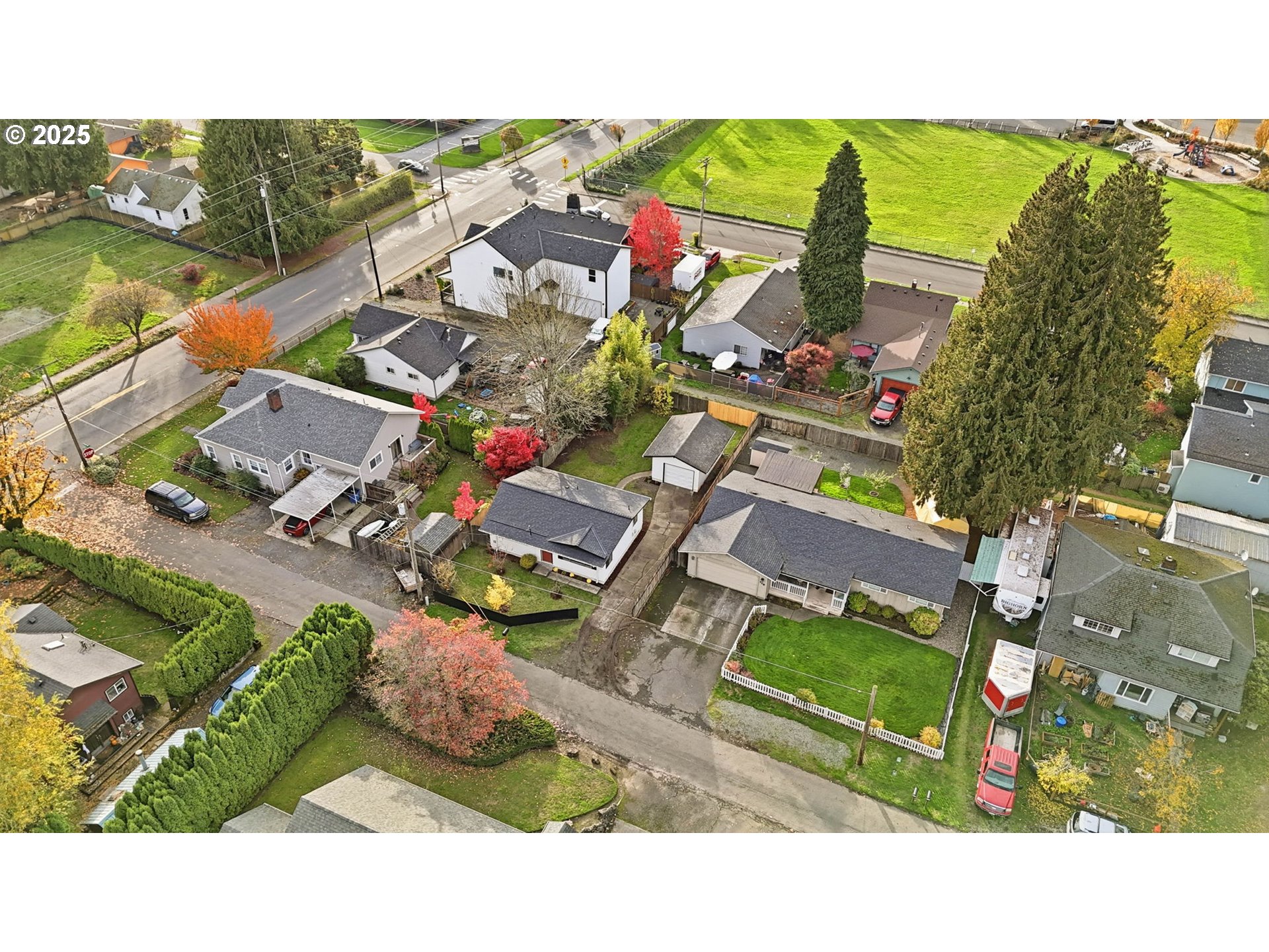 117 North 9th Avenue Ridgefield, WA 98642 - Photo 30 of 47 an aerial view of a house with a garden and lake view