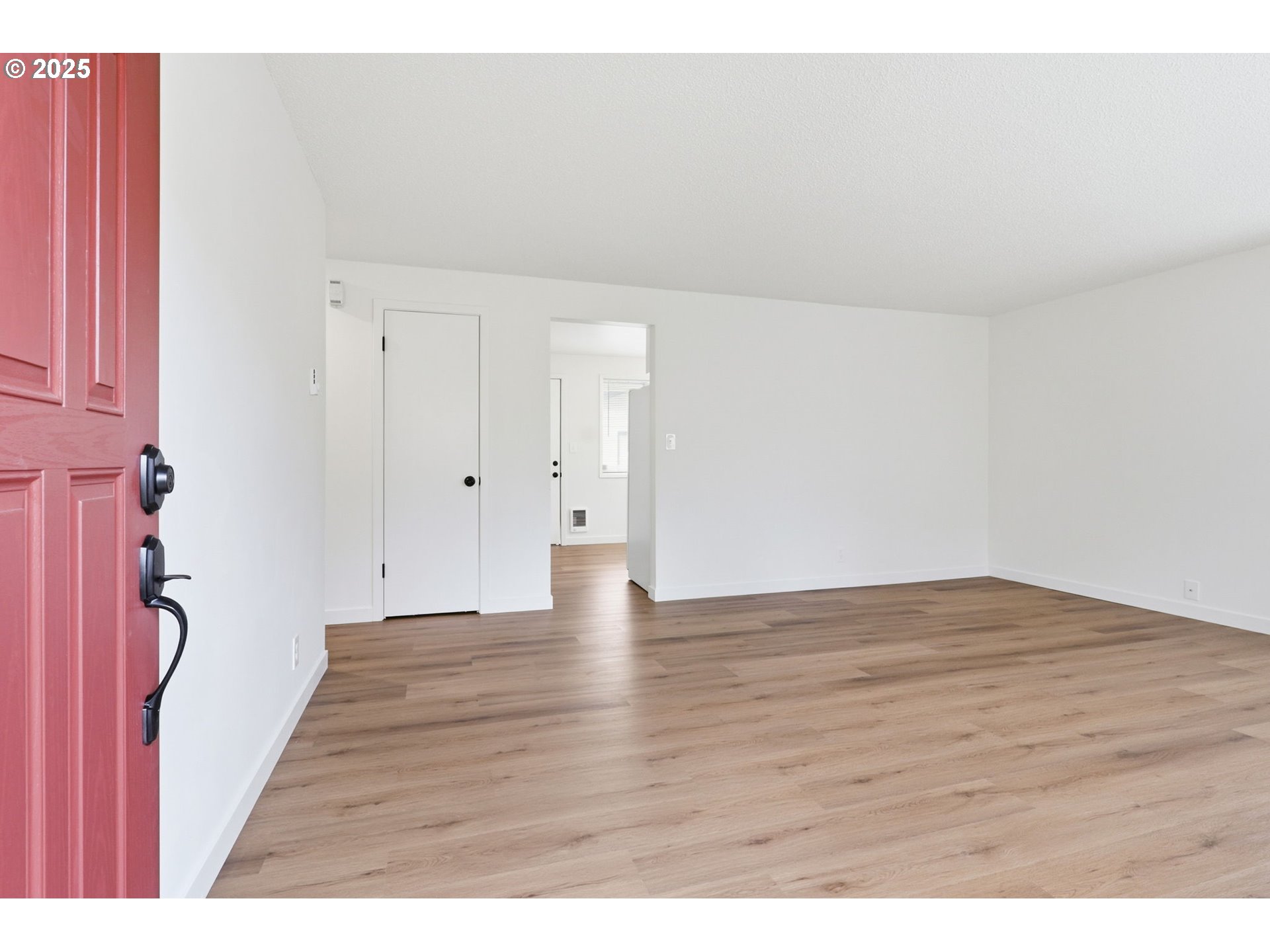 117 North 9th Avenue Ridgefield, WA 98642 - Photo 5 of 47 a view of an empty room and wooden floor