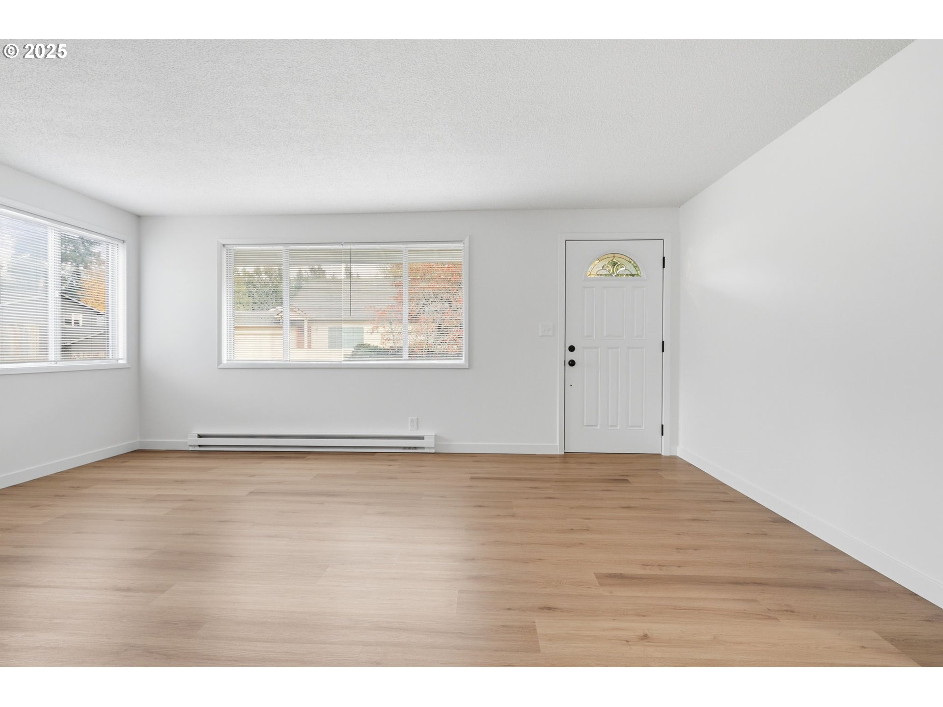 117 North 9th Avenue Ridgefield, WA 98642 - Photo 7 of 47 a view of an empty room with a window