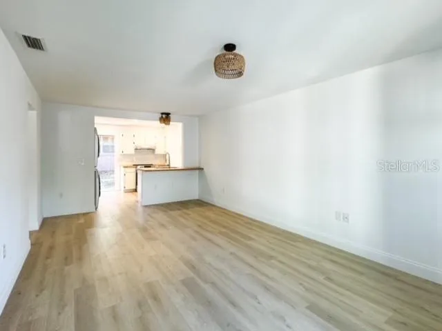 a view of a kitchen with a sink and a window