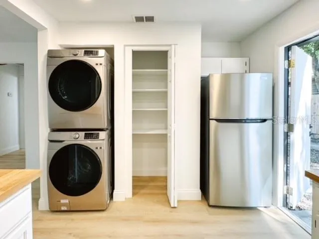 a view of a kitchen with washer and dryer