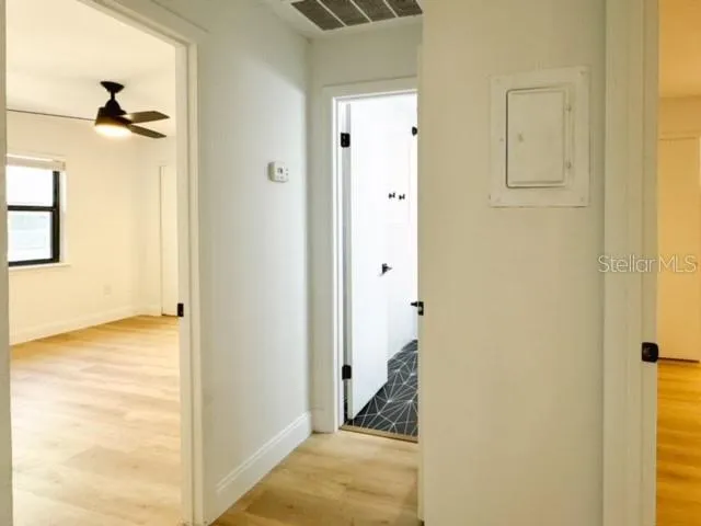 a view of a bathroom from a hallway