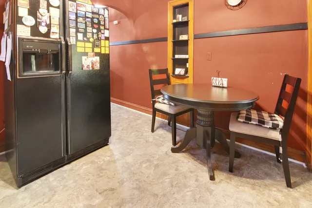 a kitchen with stainless steel appliances granite countertop a stove and a refrigerator