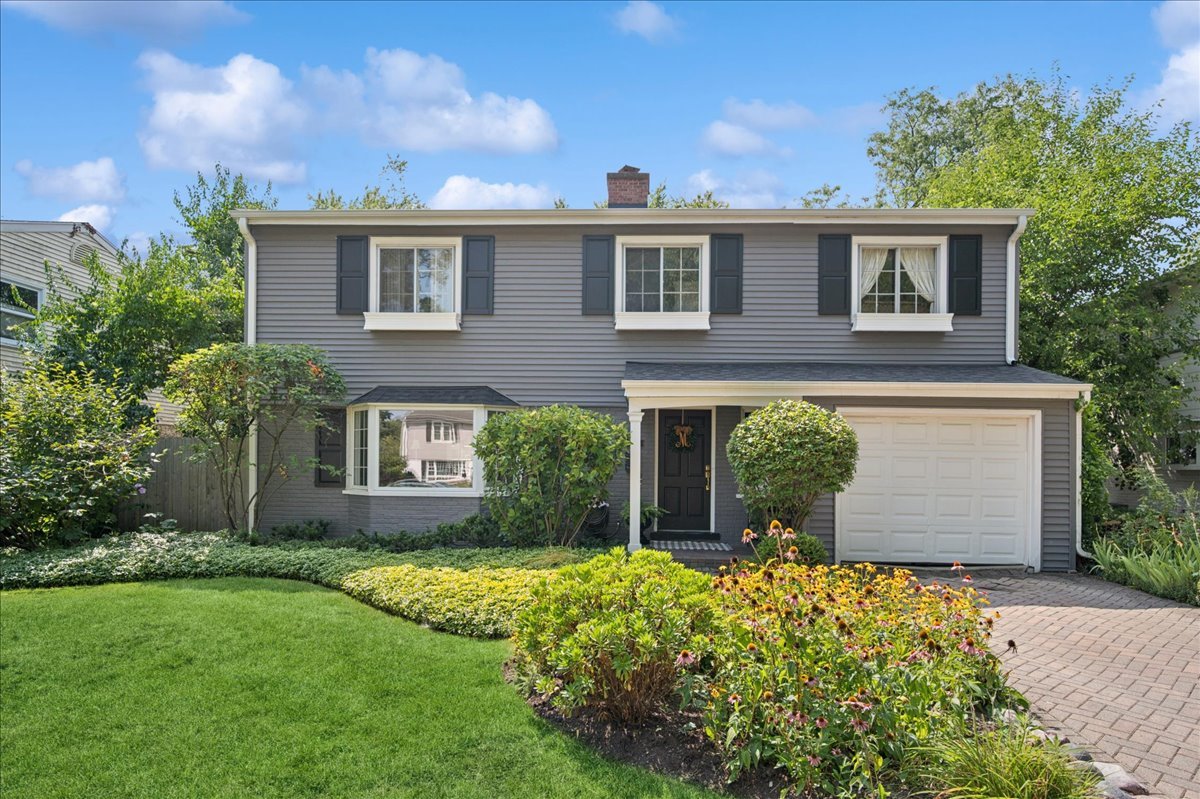 120 Riverside Drive Northfield, IL 60093 - Photo 1 of 1 a front view of a house with garden