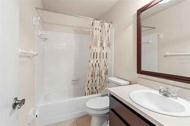 a view of a lake with houses in the back