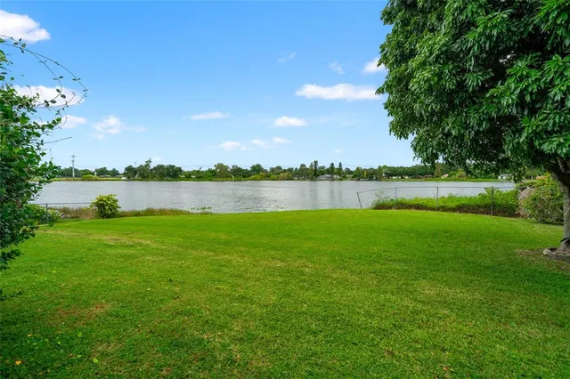 a view of a lake with houses in background