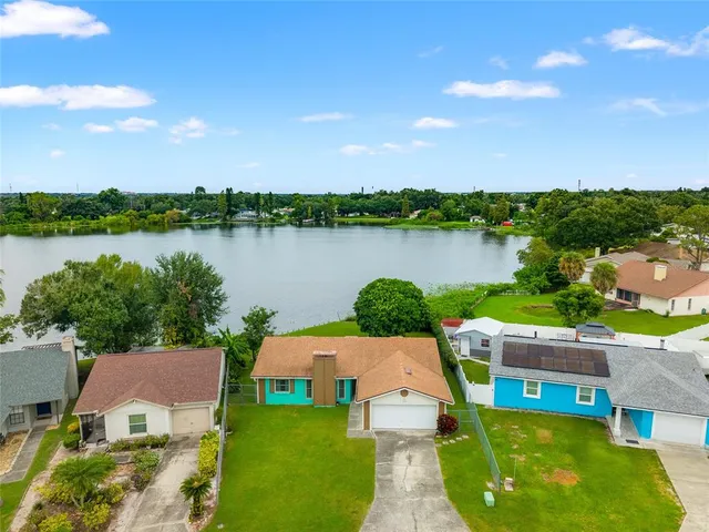 a view of a lake with couches and city view
