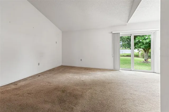 an empty room with fireplace