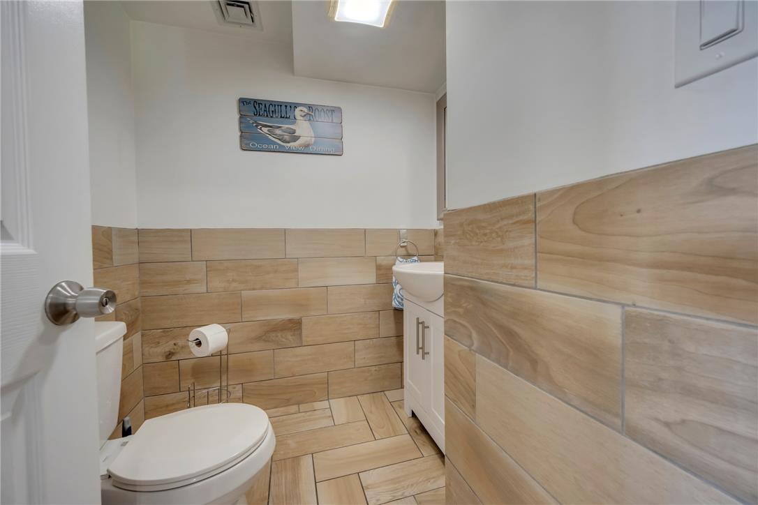 439 Cherry Hill Road Nazareth, PA 18064 - Photo 22 of 31 Functional half-bath featuring stylish wood-look tile accents and coordinating flooring.