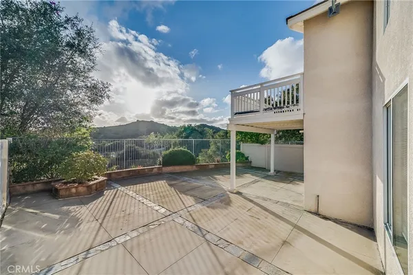 a view of a street with some trees in the background