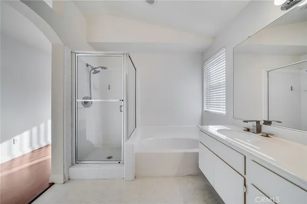 a bathroom with a bathtub and a sink
