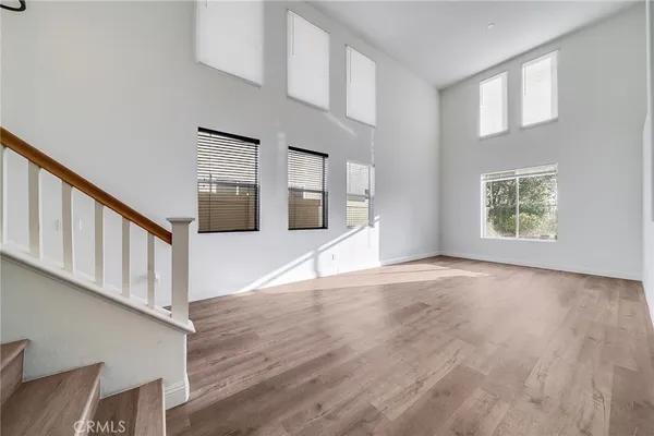 a view of an entryway with wooden floor