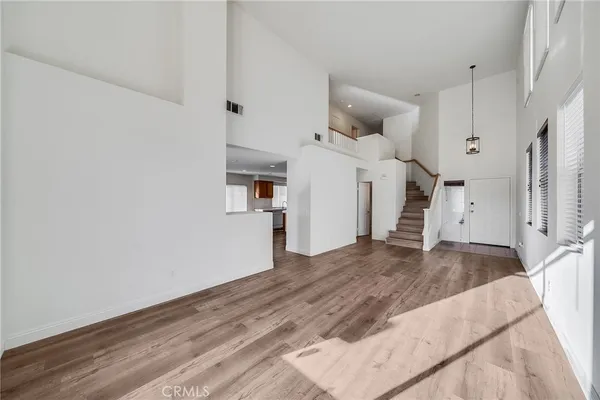 a view of a kitchen with wooden floor